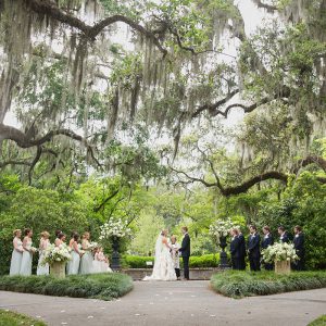 A bride and groom say their vows under three hundred year old oak trees in Murrells Inlet, SC.